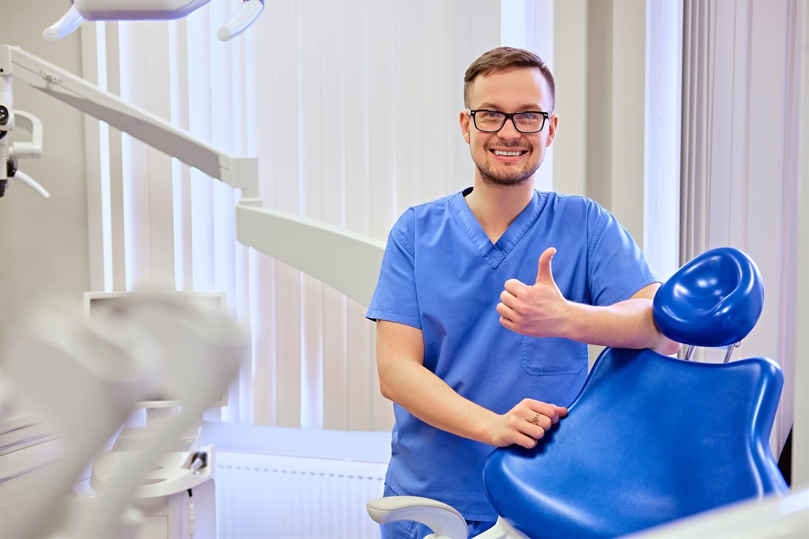 Dentist in a treatment room representing local dental visibility