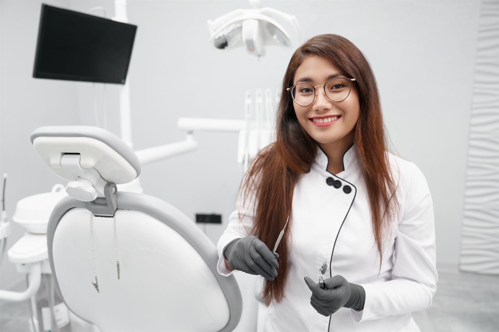 Smiling dentist in a dental clinic representing patient campaign landing pages